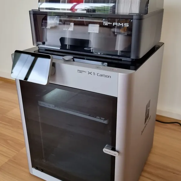 A Bambu Lab X1 Carbon with an AMS unit on top