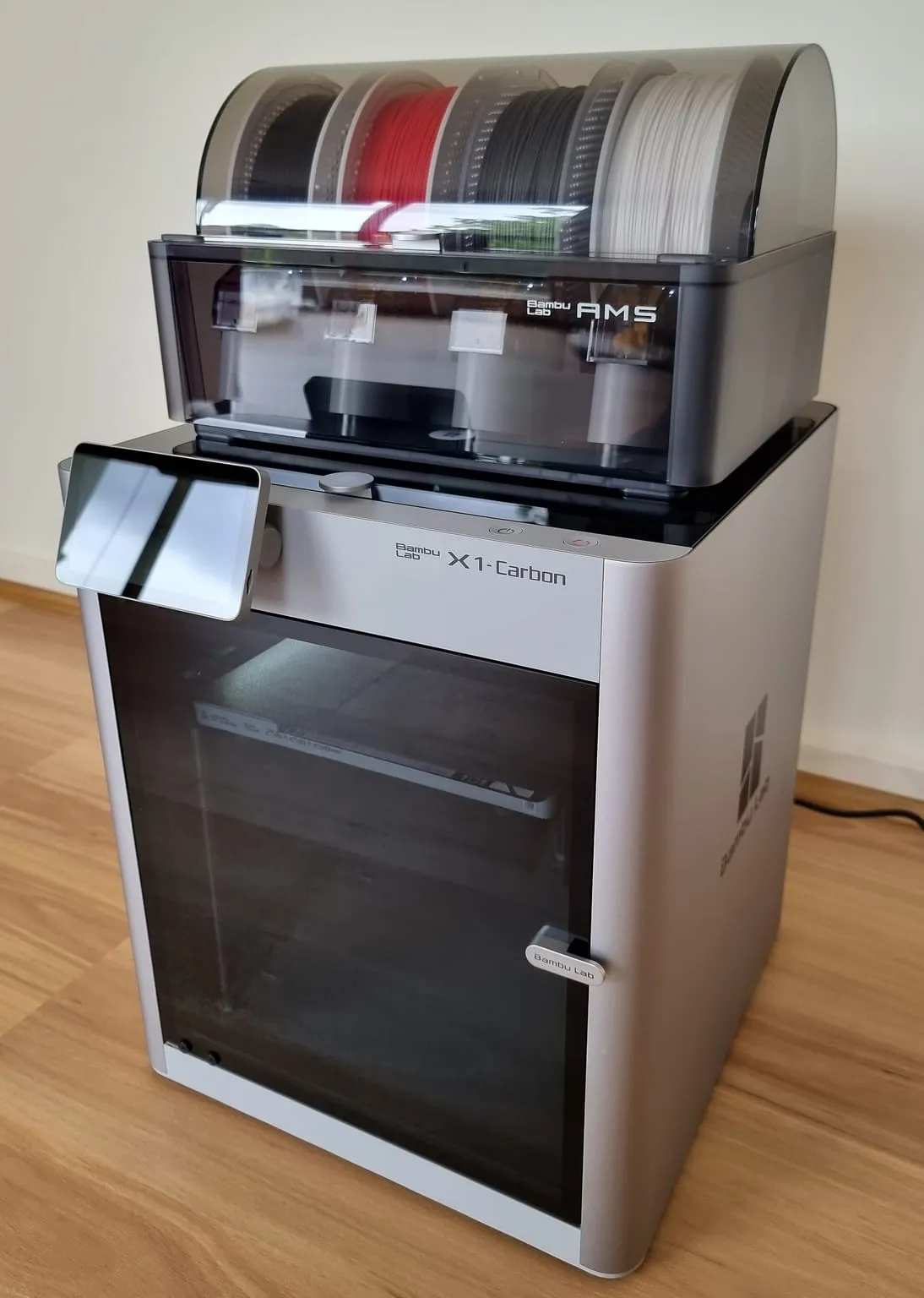 A Bambu Lab X1 Carbon with an AMS unit on top