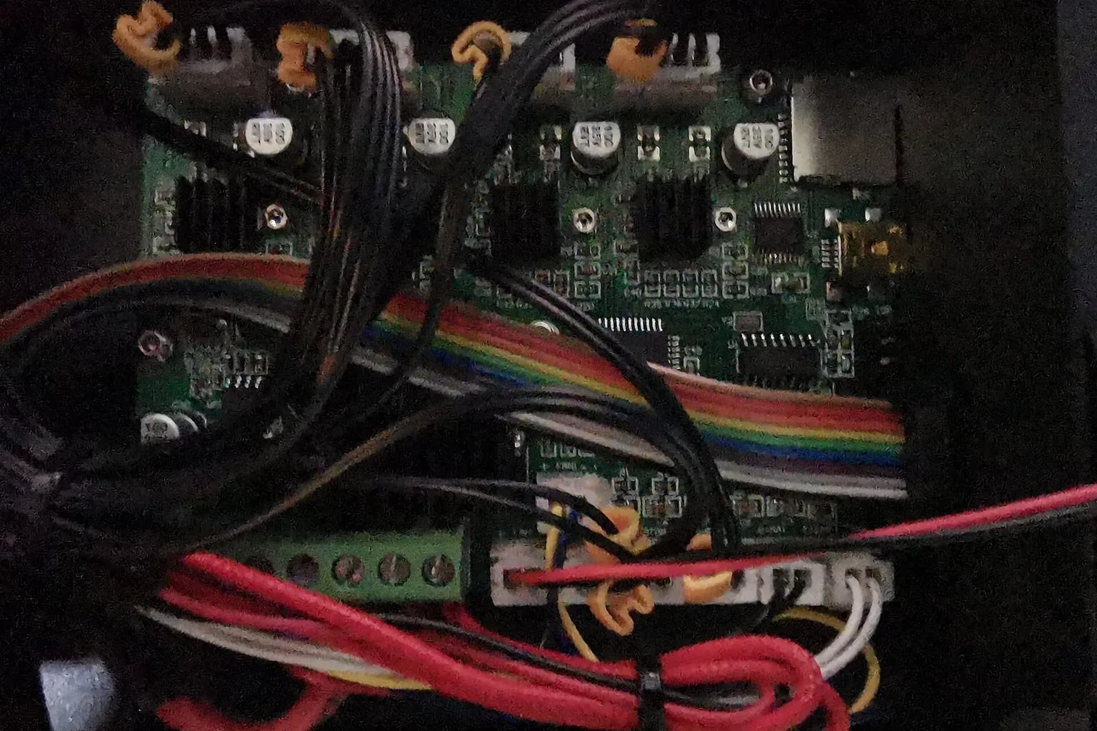 The opened electronics case of a Creality Ender 3, showing the mainboard and its wiring