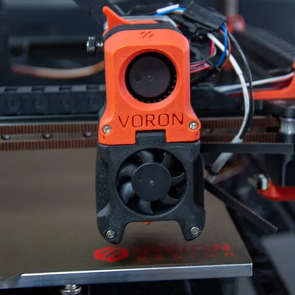 A Voron toolhead seen face-on, close above the build plate