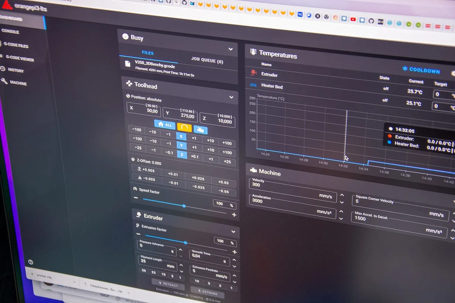 A Klipper web interface on a screen, showing toolhead position and a temperature graph