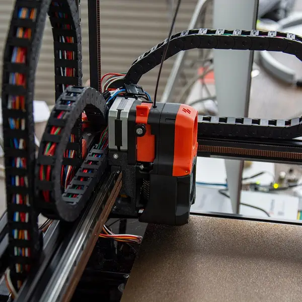 A Voron toolhead and its cable chain on the gantry, seen from above the frame