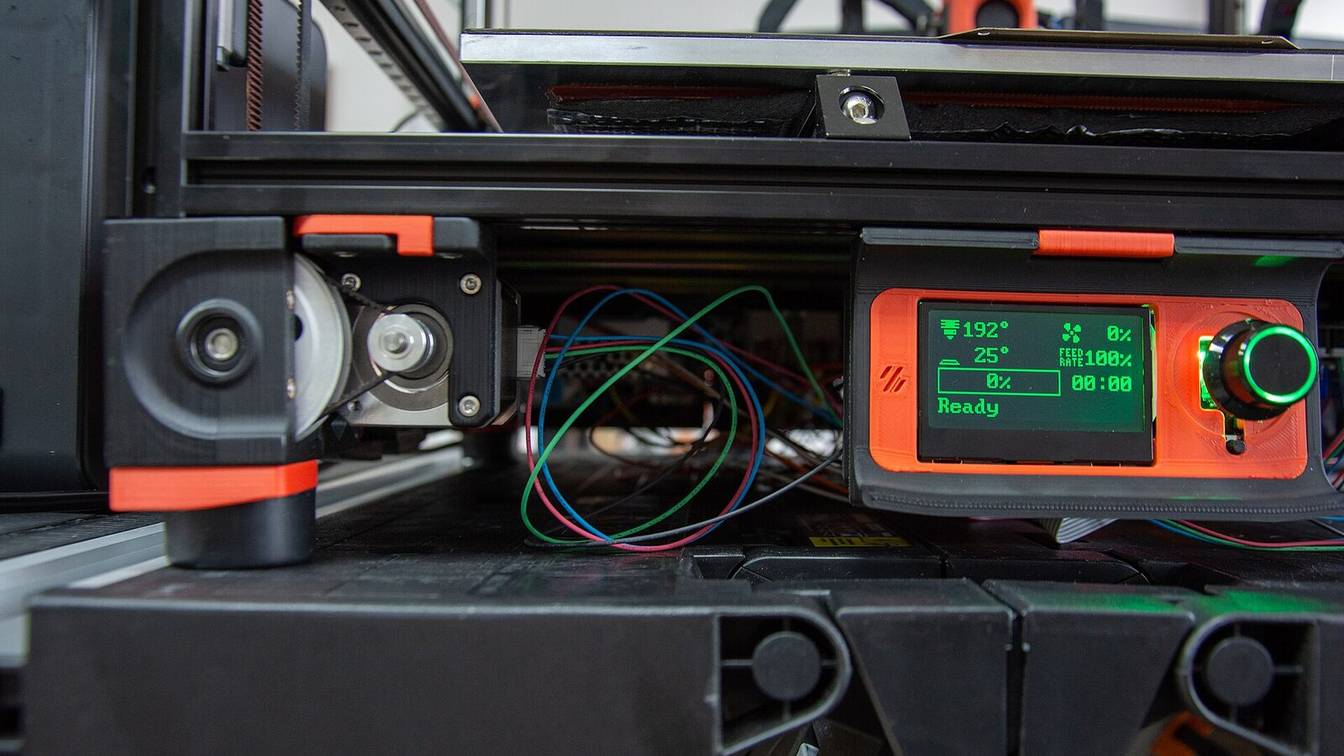 The front of a Voron printer with a small LCD status display and control knob