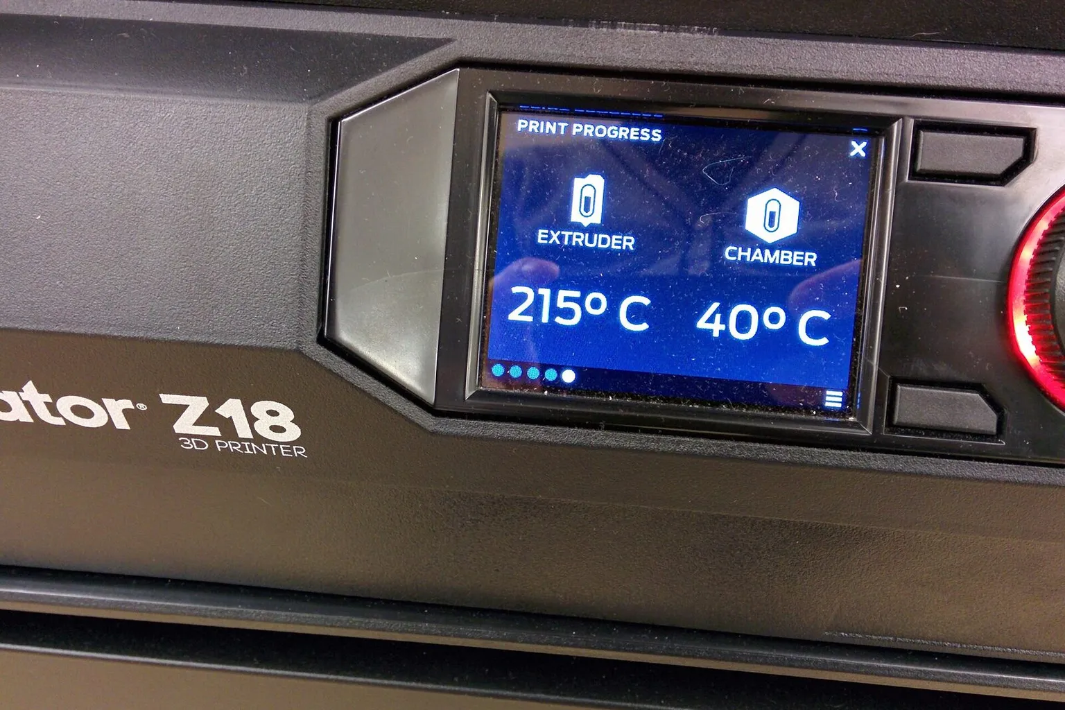 A printer touchscreen showing the extruder at 215 °C and the chamber at 40 °C