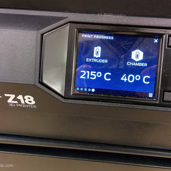 A printer touchscreen showing the extruder at 215 °C and the chamber at 40 °C